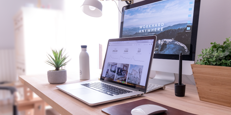 Clear desk with a laptop ready for focused digital work
